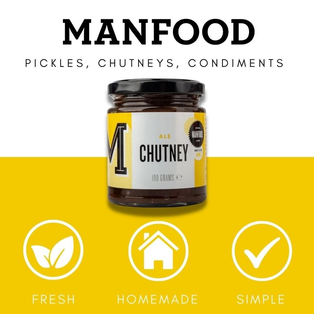 Manfood  Ale Chutney in a glass jar with a yellow label, featuring plum and ale ingredients for cheese pairings.