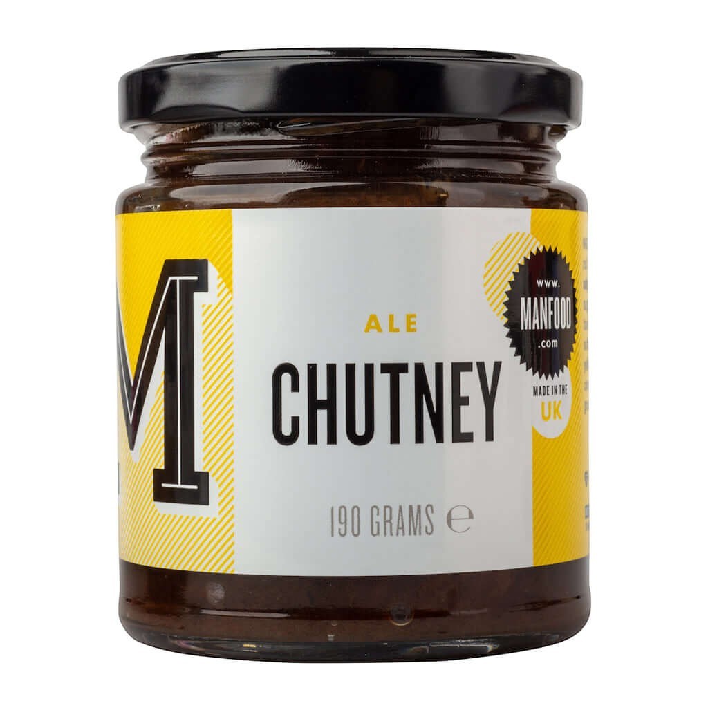 Manfood  Ale Chutney in a glass jar with a yellow and white label, featuring dark chunky fruit and ale blend.