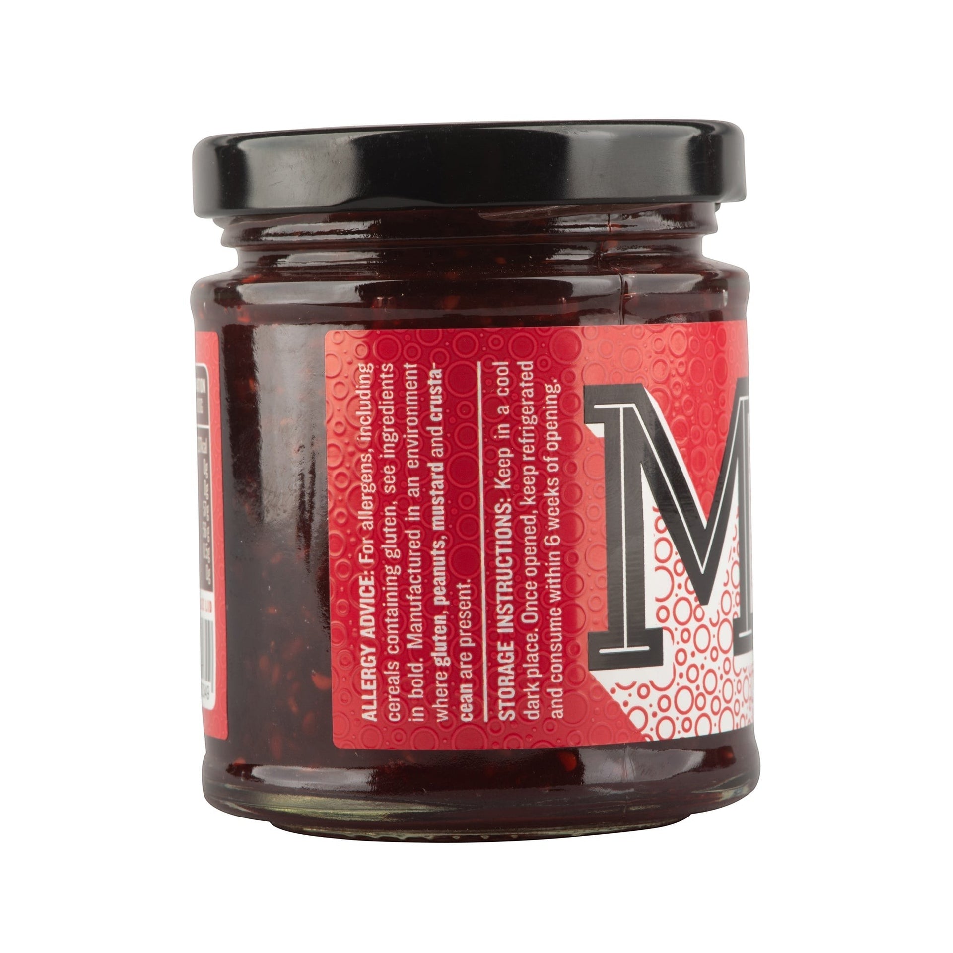 Manfood Cambs Raspberry Old Fashioned Jam in a glass jar with a red label showing ingredients and storage details.