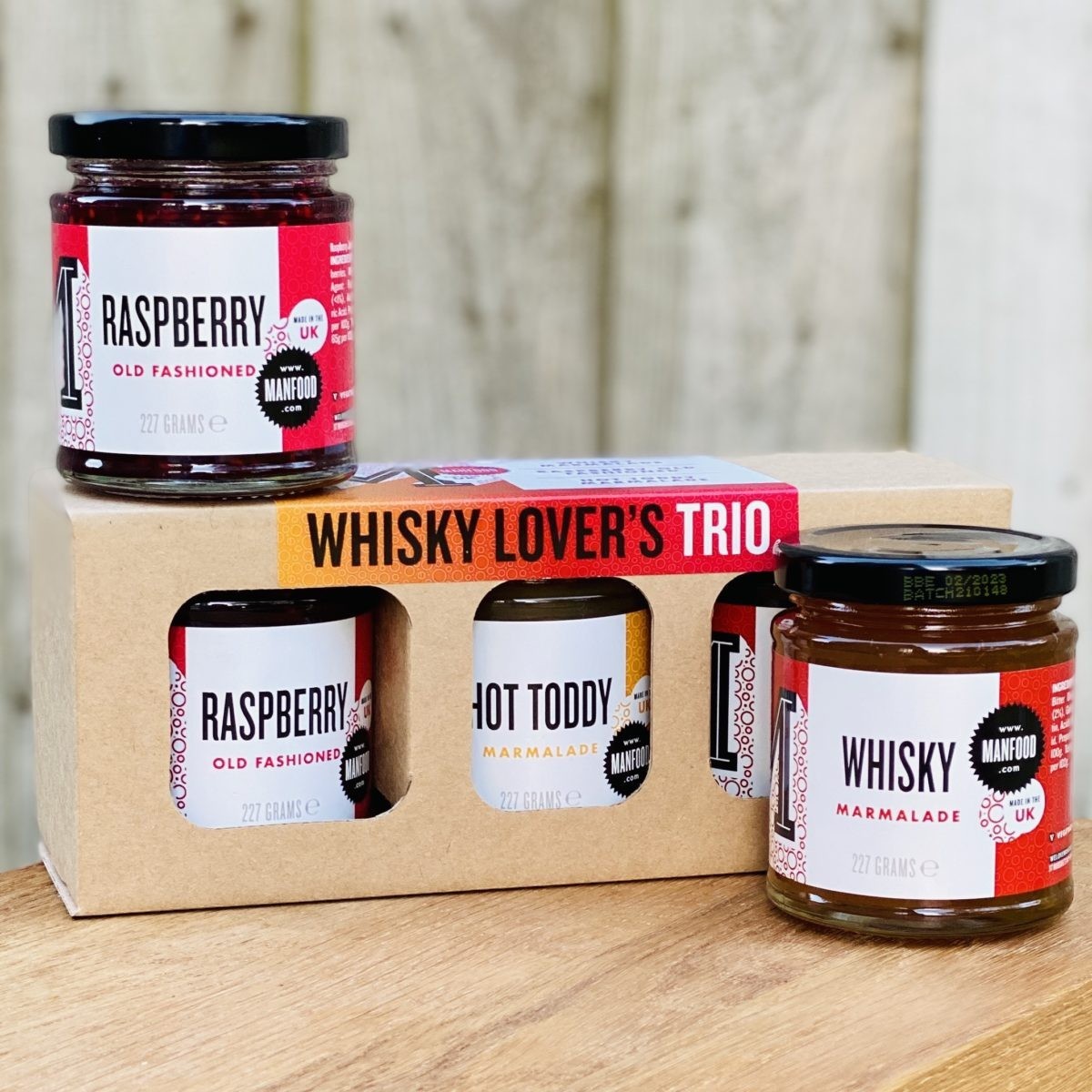Manfood Cambs Whisky Lover's Trio featuring three jars of whisky-infused jams and marmalades in a gift box.