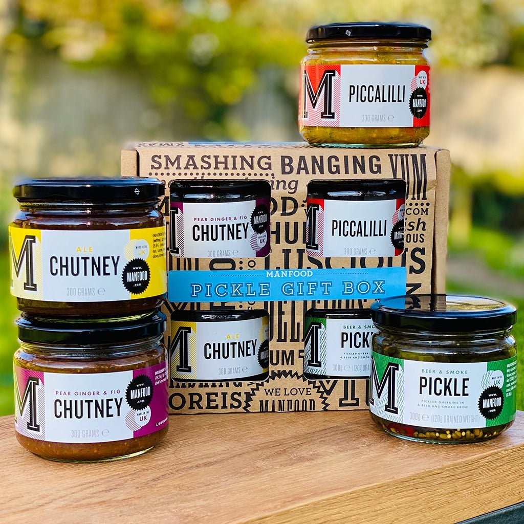 Manfood pickle gift box featuring an assortment of artisanal chutneys, piccalilli, and pickles in glass jars.