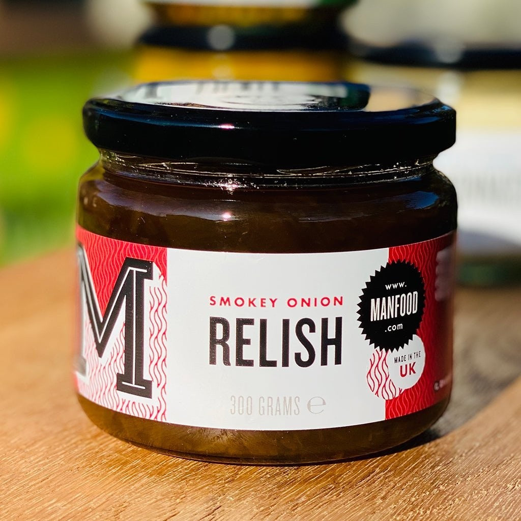 Manfood Smokey Onion Relish in a 300g glass jar with a red and white label on a wooden surface.