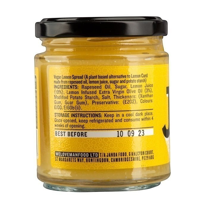Manfood vegan lemon curd in a glass jar with a yellow label showing ingredients and nutritional information.