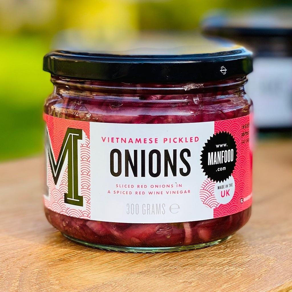 Manfood ar of sliced red onions pickled in spiced red wine vinegar for Banh Mi sandwiches